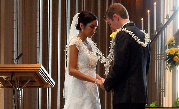 Bride & groom exchanging Wedding Lasso on the wedding day