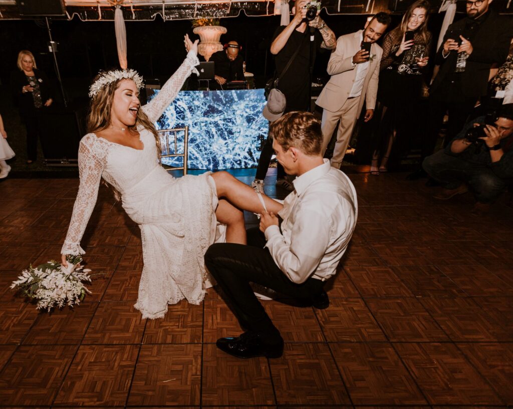 Bride & groom tossing the Garter on the wedding day